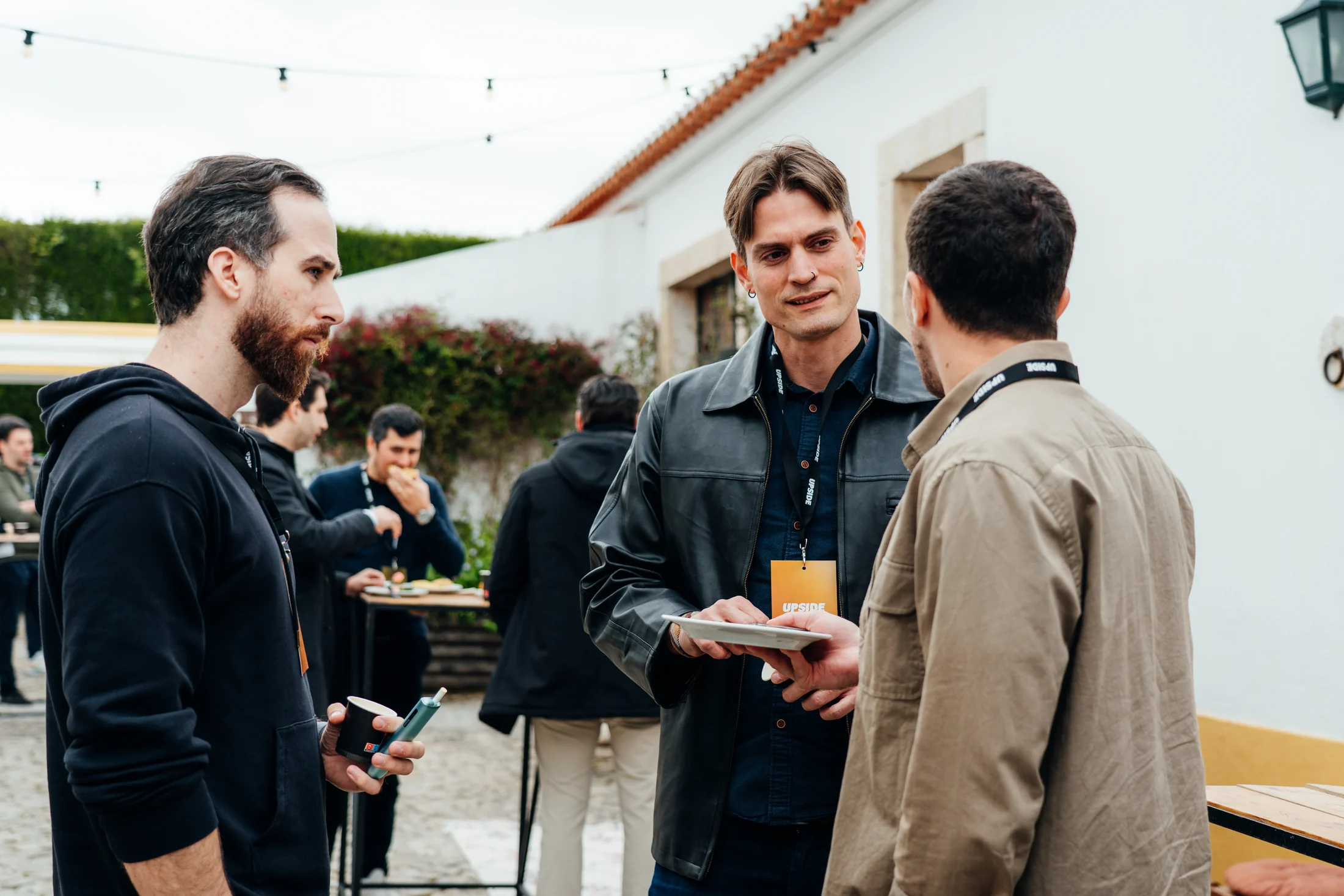 Conference guests talking in the courtyard at DOMA