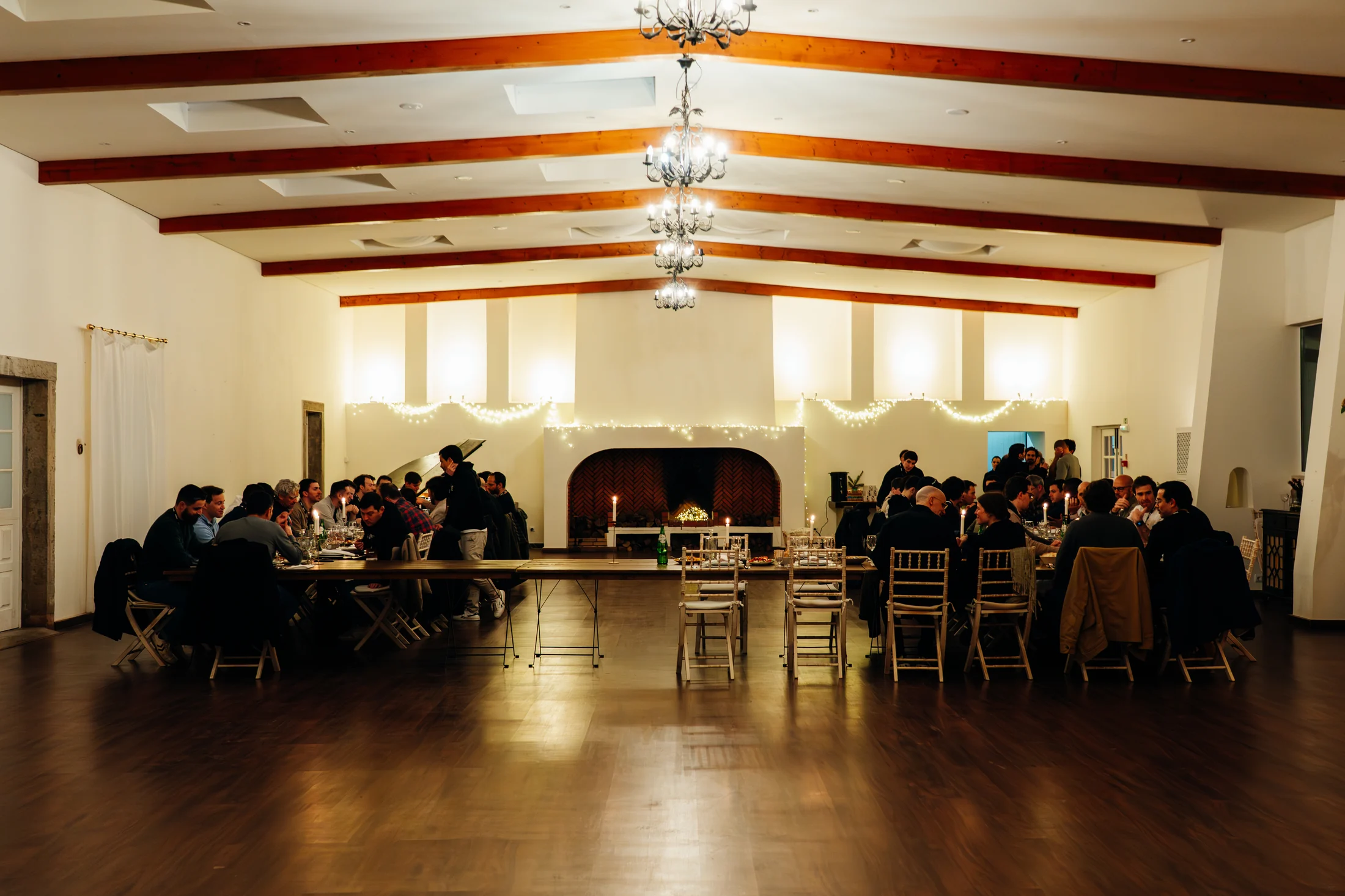 The Main Hall filled with guests at a candlelit meal at DOMA